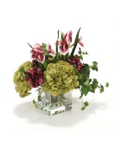 Waterlook® Plum Zinnias and Irises, Green Hydrangeas in Square Glass Vase